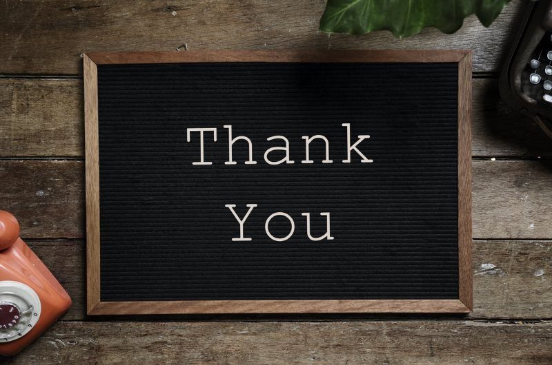 3 thank you text on black and brown board