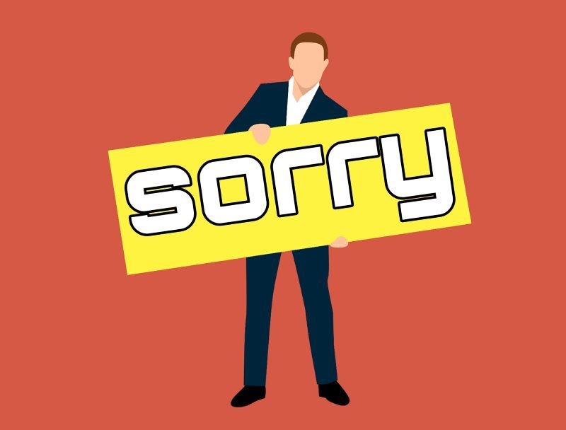 Man Cartoon Character with Sorry Board